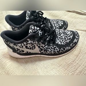 Nike youth sneakers. Black cheetah print color. Size 6.5 Y. Lightly used.